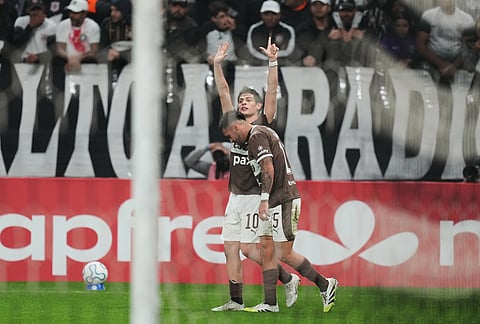 Franco Zapiola, 10, of Argentina's Platense celebrates after scoring his side's opening goal by penalty shot against Brazil's Corinthians during a Copa Libertadores Group E soccer match in Sao Paulo.