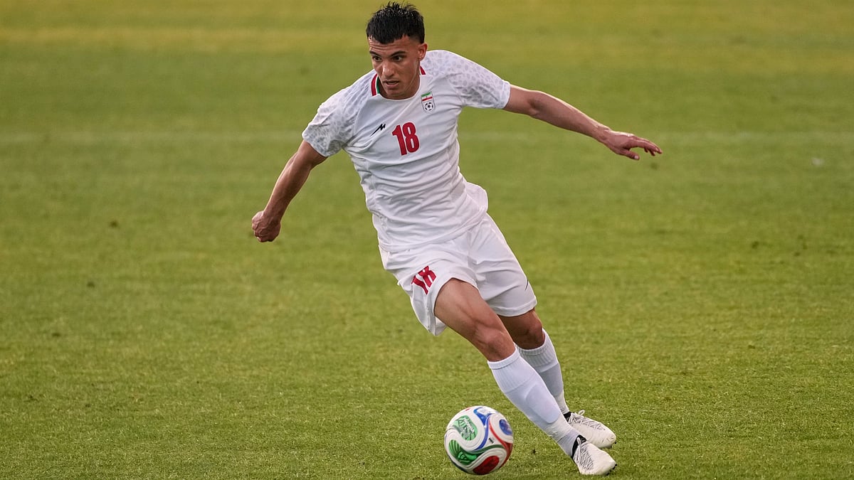 Iran's Amirhossein Hosseinzadeh plays the ball during a friendly soccer match between Iran and Gambia, in Antalya, southern Turkey. - AP Photo