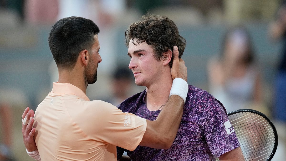 Novak Djokovic of Serbia, left, and Joao Fonseca of Brazil hug after their third round men's singles tennis match at the French Open tennis tournament in Paris, Friday, May 29, 2026. - (AP Photo/Christophe Ena)