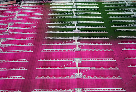 Grow lights illuminate part of the field at AT&T Stadium during a preview of the grass installed at Dallas Stadium, in Arlington, Texas,  ahead of the 2026 FIFA World Cup soccer tournament. 
