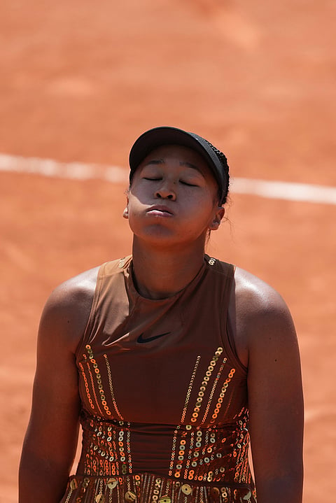 Naomi Osaka of Japan reacts as she plays against Donna Vekic of Croatia during their second round women's singles tennis match at the French Open tennis tournament in Paris.