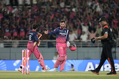 Rajasthan Royals' Donovan Ferreira with batting partner Ravindra Jadeja return after their innings during the Indian Premier League cricket match between Gujarat Titans and Rajasthan Royals in New Chandigarh, India.