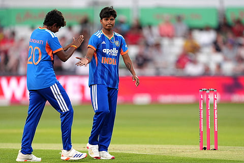 India's Arundhati Reddy (20) and Kranti Gaud celebrate the wicket of England's Sophia Dunkley during the first Vitality IT20 cricket match in Chelmsford, England.