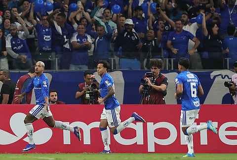 Matheus Pereira of Brazil's Cruzeiro, left, celebrates after scoring his side's opening goal against Ecuador's Barcelona during a Copa Libertadores Group D soccer match in Belo Horizonte, Brazil.