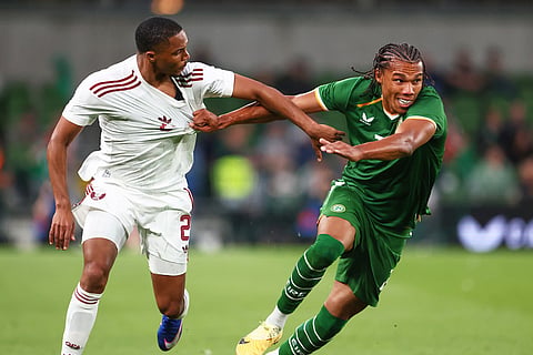 Ireland's Corrie Ndaba, right, challenges for the ball with Qatar's Pedro Miguel during the international friendly soccer match between Ireland and Qatar in Dublin, Ireland.