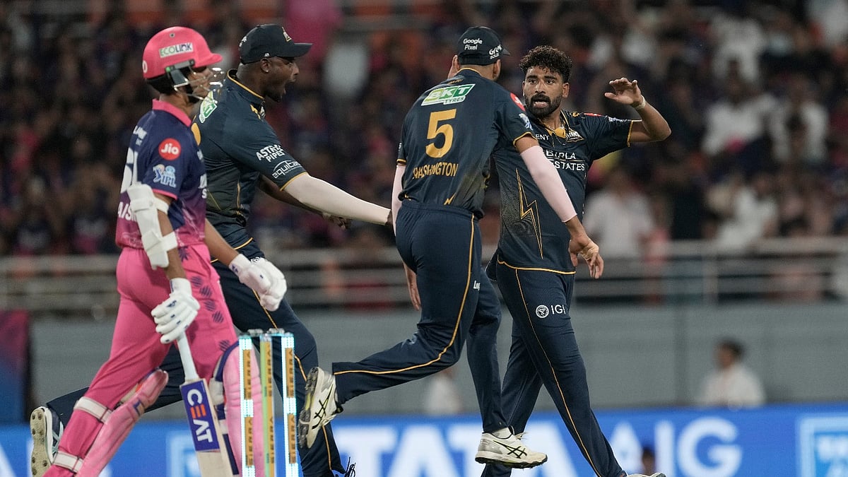 Gujarat Titans' Mohammed Siraj, right, celebrates the wicket of Rajasthan Royals' Yashasvi Jaiswal with teammates during the Indian Premier League cricket match between Gujarat Titans and Rajasthan Royals in New Chandigarh, India, Friday, May 29, 2026. (AP Photo/Ashwini Bhatia) -  AP Photo/Ashwini Bhatia