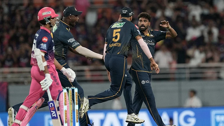 Gujarat Titans' Mohammed Siraj, right, celebrates the wicket of Rajasthan Royals' Yashasvi Jaiswal with teammates during the Indian Premier League cricket match between Gujarat Titans and Rajasthan Royals in New Chandigarh, India, Friday, May 29, 2026. (AP Photo/Ashwini Bhatia) - AP Photo/Ashwini Bhatia