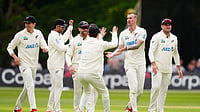 (Brian Lawless/PA via AP) : New Zealand's Blair Tickner, second right, and teammates celebrate after Ireland's Harry Tector was caught out by Tom Latham on day three of the test match in Belfast, Northern Ireland, Friday May 29, 2026.