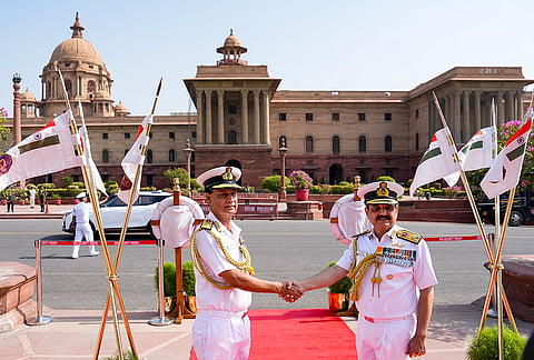 Newly-appointed Vice Chief of the Naval Staff (VCNS) Vice Admiral Ajay Kochhar, left, with outgoing VCNS Vice Admiral Sanjay Vatsayan during the Guard of Honour, at South Block Lawn, in New Delhi.
