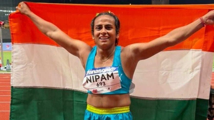 Nipam celebrates after earning the women's 100 bronze medal at the U20 Asian Athletics Championships in Hong Kong. - X/Athletics Federation of India