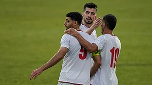 AP Photo : Iran's Mehdi Taremi, left, celebrates with teammates after scoring their side's third goal during a friendly soccer match between Iran and Gambia, in Antalya.