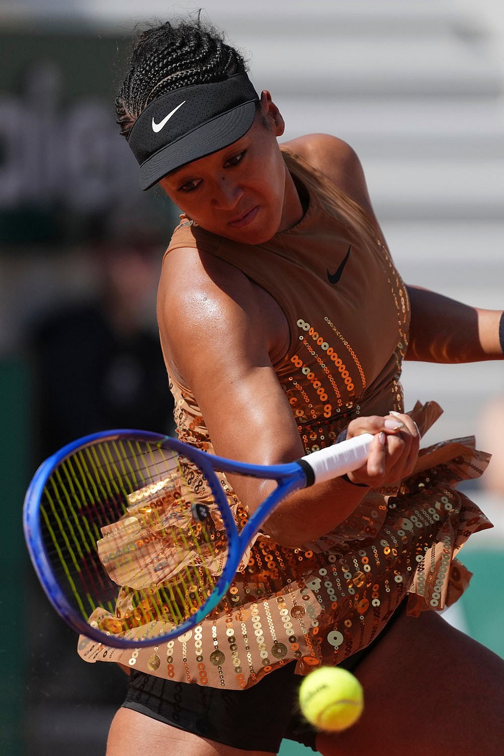 Naomi Osaka of Japan returns to Donna Vekic of Croatia during their second round womens singles tennis match at the French Open tennis tournament in Paris.