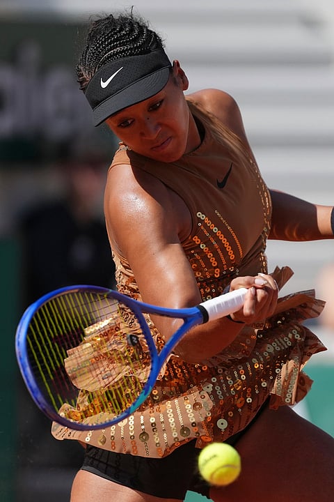 Naomi Osaka of Japan returns to Donna Vekic of Croatia during their second round women's singles tennis match at the French Open tennis tournament in Paris.