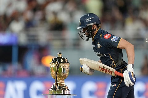 Gujarat Titans' captain Shubman Gill walks in to bat during the Indian Premier League cricket match between Gujarat Titans and Rajasthan Royals in New Chandigarh, India.