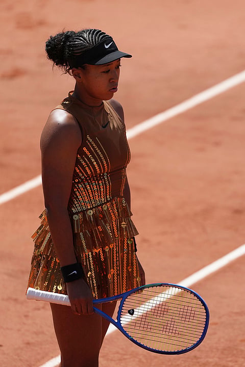 Naomi Osaka of Japan reacts as she plays against Donna Vekic of Croatia during their second round women's singles tennis match at the French Open tennis tournament in Paris.
