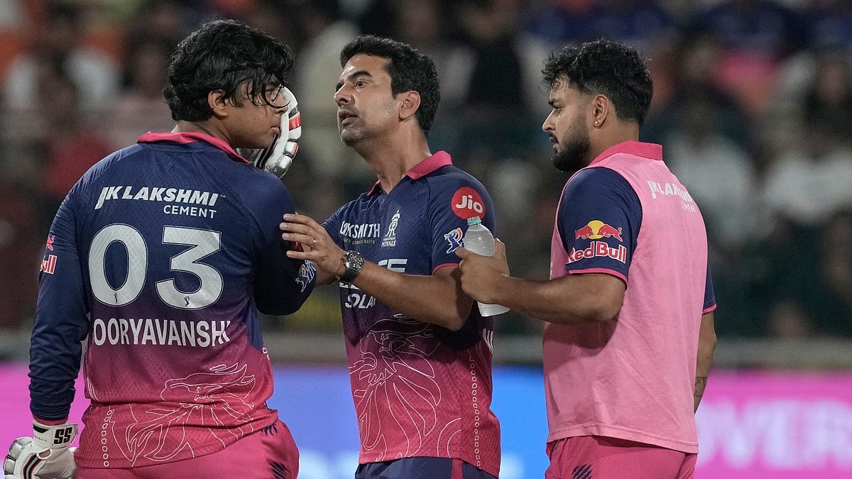 A team medic checks Rajasthan Royals' Vaibhav Sooryavanshi after a ball hits Sooryavanshi's helmet during the Indian Premier League cricket match between Gujarat Titans and Rajasthan Royals in New Chandigarh, India, Friday, May 29, 2026. - AP Photo/Ashwini Bhatia