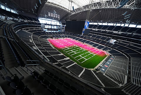 Grow lights illuminate part of the field at AT&T Stadium during a preview of the grass installed at Dallas Stadium, in Arlington, Texas,  ahead of the 2026 FIFA World Cup soccer tournament. 
