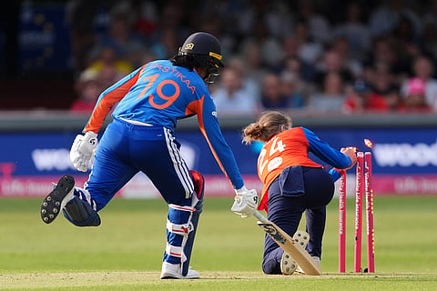 India's Yastika Bhatia is run out by England's Charlie Dean during the first Vitality IT20 women's cricket match between England and India in Chelmsford, England.