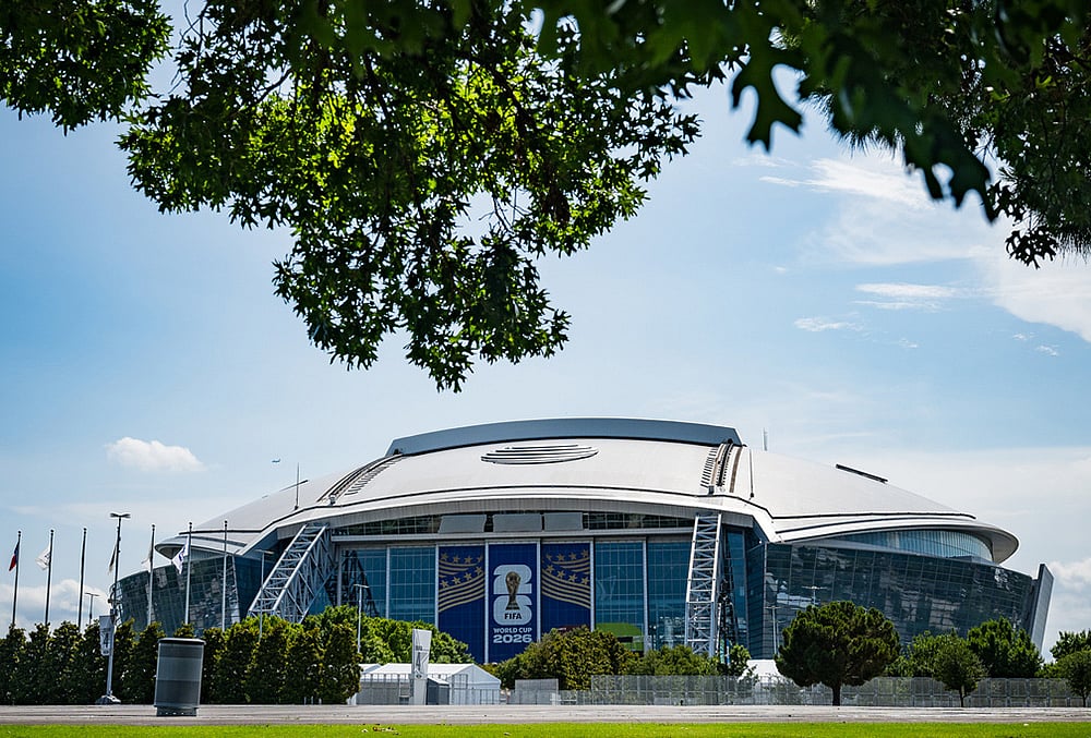 | Photo: AP/Jessica Tobias : Signage on the exterior of AT&T Stadium, which will be named Dallas Stadium during the 2026 FIFA World Cup, is covered by workers as preparations continue at the venue ahead of the soccer tournament Arlington, Texas. 