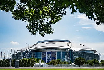 | Photo: AP/Jessica Tobias : Signage on the exterior of AT&T Stadium, which will be named Dallas Stadium during the 2026 FIFA World Cup, is covered by workers as preparations continue at the venue ahead of the soccer tournament Arlington, Texas.