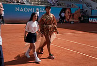 | Photo: AP/Thibault Camus : Naomi Osaka of Japan enters the court for the third round women's singles tennis match against Iva Jovic of the U.S. at the French Open tennis tournament in Paris.