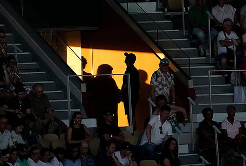 Spectators watch the second round men's singles tennis match between Tomas Machac of the Czech Republic and Alexander Zverev of Germany at the French Open tennis tournament in Paris.