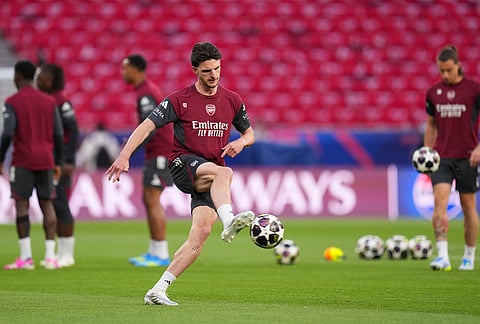 Arsenal's Declan Rice kicks a ball during a training session ahead of the Champions League final soccer match between Paris Saint-Germain and Arsenal in Budapest, Hungary.