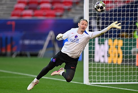 PSG's goalkeeper Matvey Safonov saves during a training session ahead of the Champions League final soccer match between Paris Saint-Germain and Arsenal in Budapest, Hungary.
