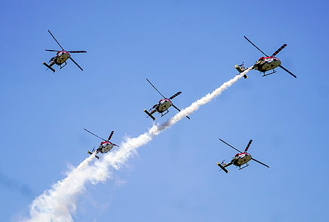 Indian Air Force's (IAF) Sarang display team performs manoeuvres during the convocation ceremony of the 150th course of National Defence Academy (NDA) at Khadakwasla, in Pune district, Maharashtra.