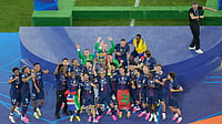 AP : PSG players celebrate with the trophy after winning the Champions League final soccer match against Arsenal in Budapest, Hungary.