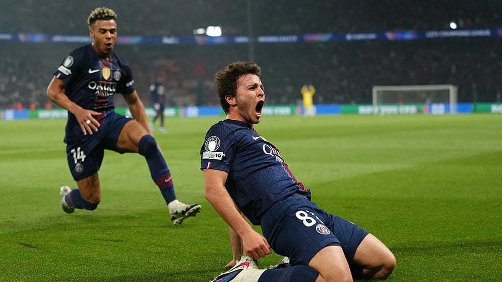 PSG's Joao Neves celebrates after scoring his side's second goal during a Champions League semifinal, first leg, soccer match between Paris Saint-Germain and Bayern Munich in Paris. - | Photo: AP/Aurelien Morissard