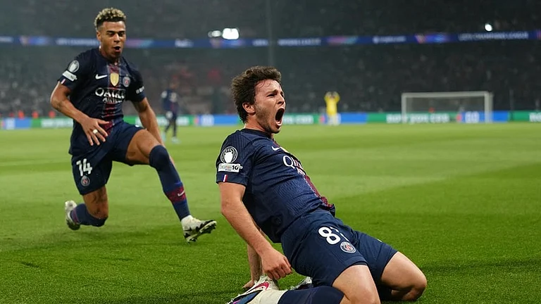 PSG's Joao Neves celebrates after scoring his side's second goal during a Champions League semifinal, first leg, soccer match between Paris Saint-Germain and Bayern Munich in Paris. - | Photo: AP/Aurelien Morissard