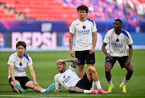 PSG players relax during a training session ahead of the Champions League final soccer match between Paris Saint-Germain and Arsenal in Budapest, Hungary.