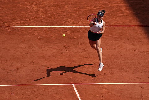 Iva Jovic of the U.S. returns to Naomi Osaka of Japan during their third round women's singles tennis match at the French Open tennis tournament in Paris.