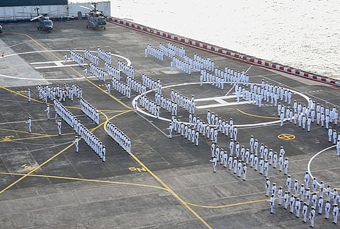 Naval officials take part in the ceremonial parade for the change of command of the Flag Officer Commanding-in-Chief (FOC-IN-C) of the Western Naval Command, at the INS Shikhra naval helicopter base, in Mumbai, Maharashtra.