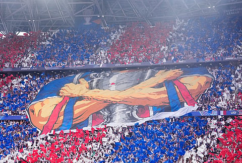 PSG fans unfurl a banner on the stands during the Champions League final soccer match between Paris Saint-Germain and Arsenal in Budapest, Hungary.