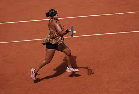 Naomi Osaka of Japan returns to Iva Jovic of the U.S. during their third round women's singles tennis match at the French Open tennis tournament in Paris.