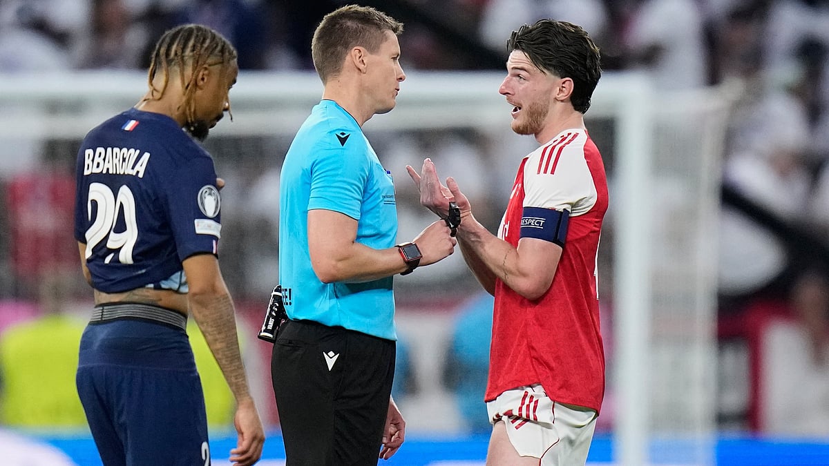 Declan Rice speaks to Referee Daniel Siebert during the Champions League final soccer match between Paris Saint-Germain and Arsenal in Budapest. - AP/Petr Josek