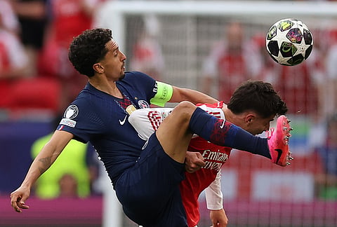 PSG's Marquinhos, left, and Arsenal's Kai Havertz fight for the ball during the Champions League final soccer match between Paris Saint-Germain and Arsenal in Budapest, Hungary.