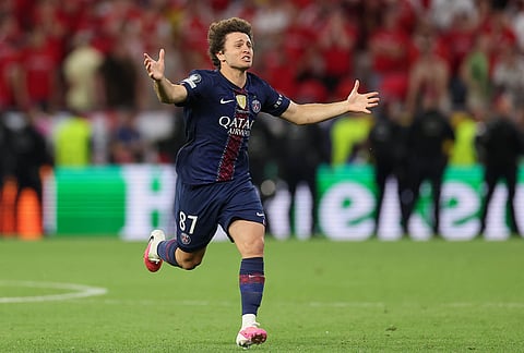 PSG's Joao Neves celebrates after winning the Champions League final soccer match between Paris Saint-Germain and Arsenal in Budapest, Hungary.