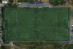 | Photo: AP/Thanassis Stavrakis : An amateur soccer field is seen from above as migrant teams from Guinea and Afghanistan play soccer during the Kypseli Mundial in Athens, Greece.