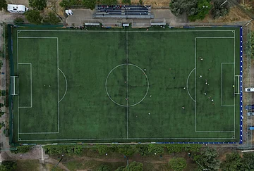 | Photo: AP/Thanassis Stavrakis : An amateur soccer field is seen from above as migrant teams from Guinea and Afghanistan play soccer during the Kypseli Mundial in Athens, Greece.