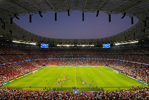 Players walks on the pitch during the Champions League final soccer match between Paris Saint-Germain and Arsenal in Budapest, Hungary.