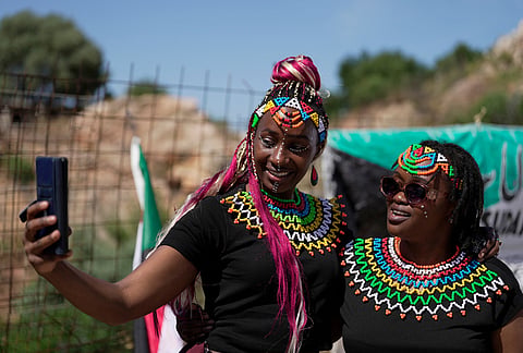 Two women take a selfie during the Kypseli Mundial in Athens, Greece.