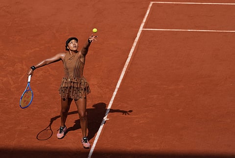 Naomi Osaka of Japan serves to Iva Jovic of the U.S. during their third round women's singles tennis match at the French Open tennis tournament in Paris.