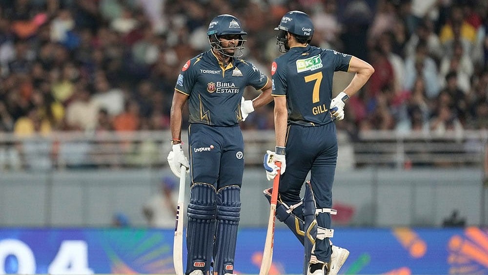Gujarat Titans' captain Shubman Gill with batting partner Sai Sudharsan talk after scoring runs during the Indian Premier League cricket match between Gujarat Titans and Rajasthan Royals in New Chandigarh, India. - | Photo: AP/Ashwini Bhatia.