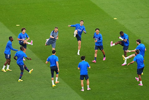 Paris Saint-Germain players warm up prior to the Champions League final soccer match between Paris Saint-Germain and Arsenal in Budapest, Hungary.