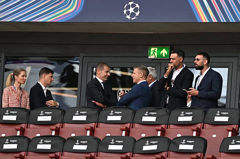 UEFA President Aleksander Ceferin, center left, speaks with Hungary's Prime Minister Peter Magyar prior to the Champions League final soccer match between Paris Saint-Germain and Arsenal in Budapest, Hungary, Saturday, May 30, 2026.