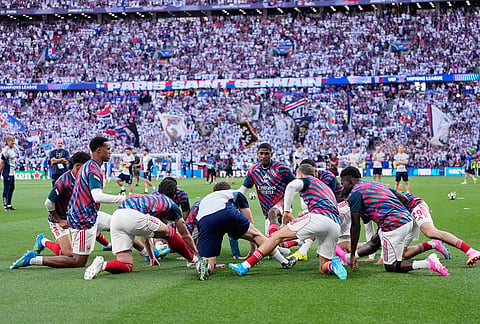 Arsenal players exercise during warmup before the Champions League final soccer match between Paris Saint-Germain and Arsenal in Budapest, Hungary.