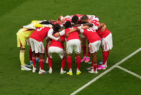 Arsenal team huddles just prior to kick off of the Champions League final soccer match between Paris Saint-Germain and Arsenal in Budapest, Hungary.
